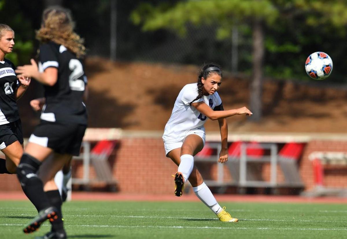 Miah Araba (10) of Carrboro takes a shot on goal against Abby Walker (2) of West Stokes. The Carrboro Jaguars played the West Stokes Wildcats in a soccer game that took place in Raleigh, N.C. on Saturday, May 27 2017. Carrboro won 3-0.