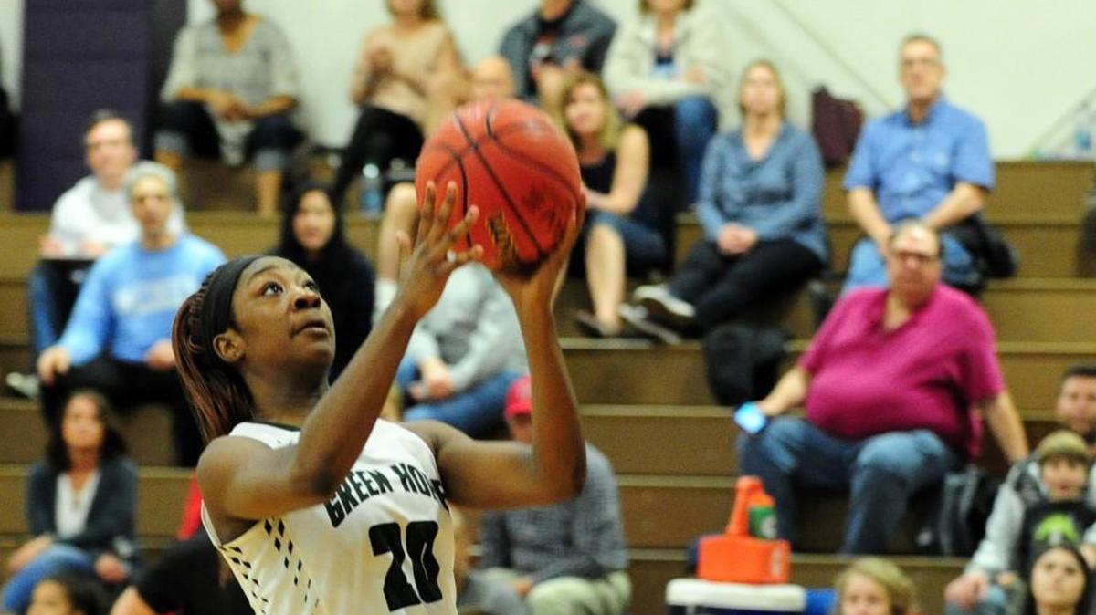 Green Hope's Nia Washington takes an open shot. The Green Hope Falcons and the Riverside Pirates girls and the Green Hope Falcons and the Panther Creek Catamounts boys played in the Triangle-6 4A Conference basketball tournament championships in Durham on Friday, February 16, 2018.