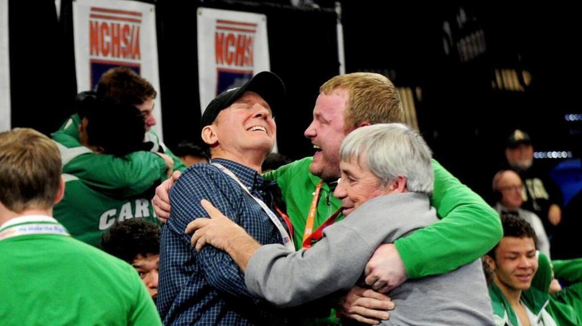 Cary's coaches celebrate winning the state title. The NCHSAA State Championship wrestling matches took place in Greensboro on Saturday, February 3, 2018.
