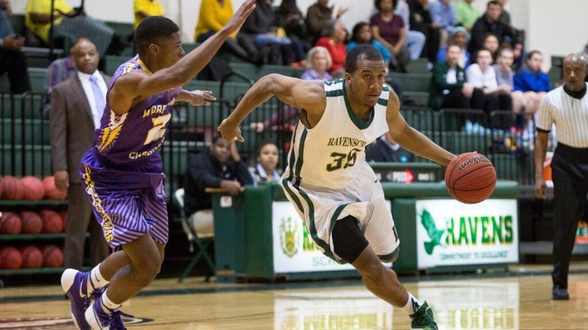 Ravenscroft’s Ian Dubose (35) handles the ball as Word of God’s Zach Newkirk (2) defends during a high school basketball game in Raleigh, N.C. on Wednesday, Feb. 3, 2016. Word of God defeated Ravenscroft 77-68.