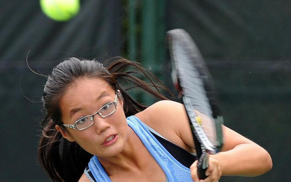 
Panther Creek's Melody Zhang returns a serve during the girls tennis match against Green Hope on Thursday, September 24, 2015 in Cary.
