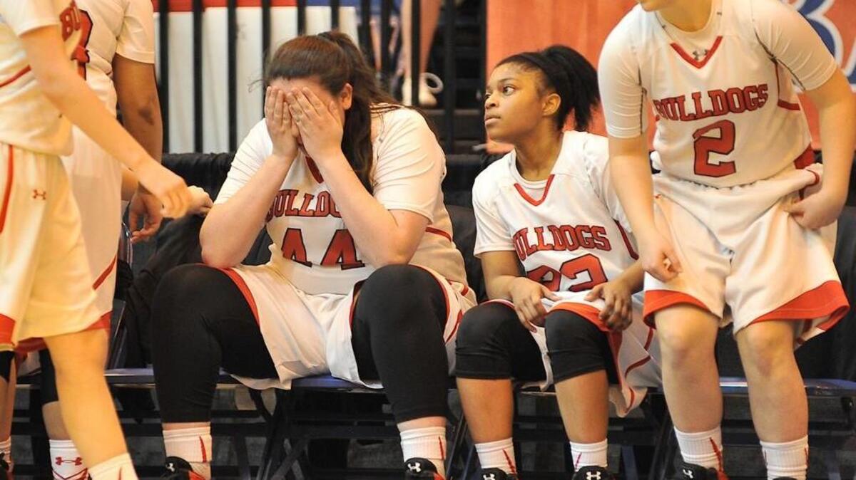 Roxboro Community's Jasmine Wiggans (44) shows emotion after her team's loss to Plymouth in the NCHSAA 1A East girls final. The Roxboro Community Bulldogs took on the Plymouth Vikings in the NCHSAA 1A East Final in Crown Arena in Fayetteville, N.C. on March 5, 2016. Plymouth wins 50-37.