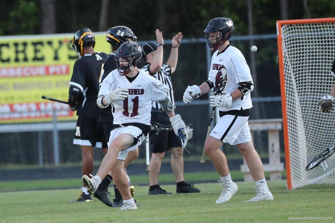 Wakefield's Kevin Ritter ( (11) celebrates his goal. The Apex Cougars visited the Wakefield Wolverines in a high school Blax game on May 8, 2018 in Raleigh, N.C. 27604.