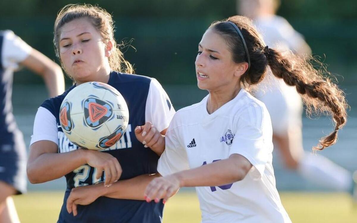 Miah Araba, right, of Carrboro vies for the ball against Lauren Taylor, left, of First Flight. The Carrboro Jaguars played the First Flight Nighthawks in a girls soccer game that took place in Carrboro, N.C. on Tuesday, May 24, 2016. Carrboro won 5-0.