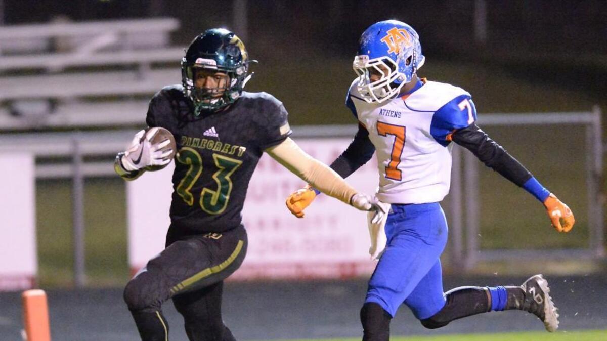 Zaythan Hill (23) of Pinecrest scores a touchdown against the pursuit of Justin Smith (7) of Athens Drive. The Athens Drive Jaguars visited the Pinecrest Patriots in a high school football game on Nov. 10, 2017. Pinecrest won 50-19.