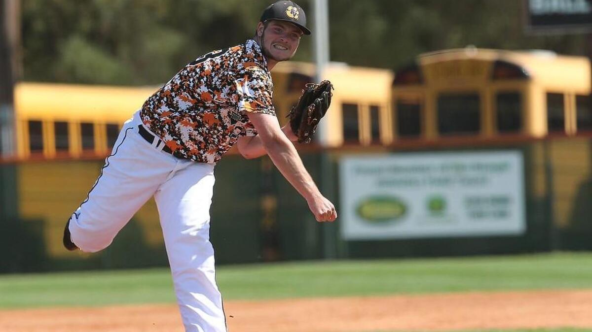 Fuquay-Varina's Austin harris (23) throws hard during the Middle Creek high school baseball game against Fuquay-Varina high school April,11, 2015 in Fuquay, N.C. Fuquay-Varina won 4-2.