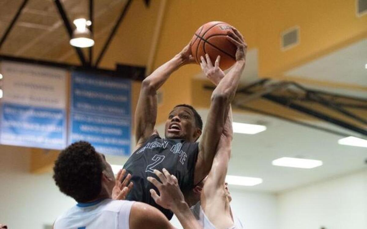 Green Hope's Alex Clinkscales (2) gets a tough rebound during matchup between Green Hope and Panther Creek that took place at Panther Creek High School on December 13, 2016 in Cary, North Carolina. Panther Creek girls defeated Green Hope 54-51. Green Hope boys defeated Panther Creek 61-56.