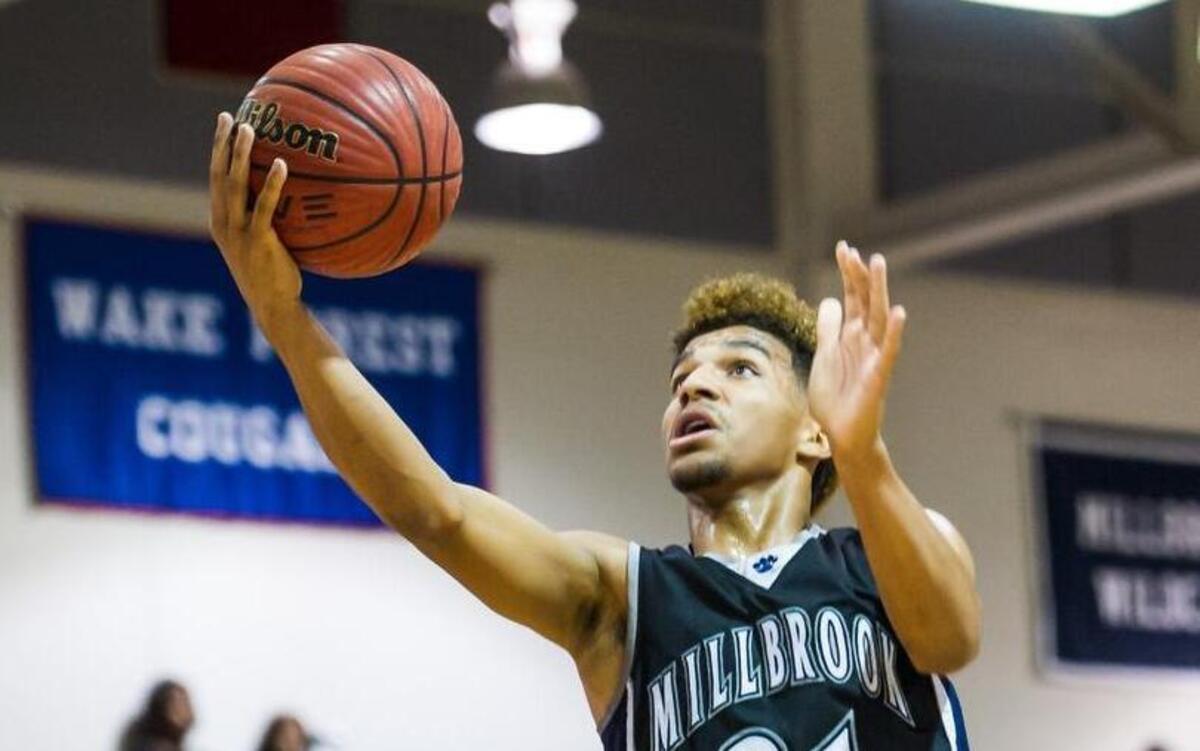 Millbrook’s John Burwell (21) attempts a layup during a boys basketball game against Wake Forest Cougars on Tuesday, December 15, 2015 in Wake Forest, N.C. The Millbrook Wildcats won 84-37.