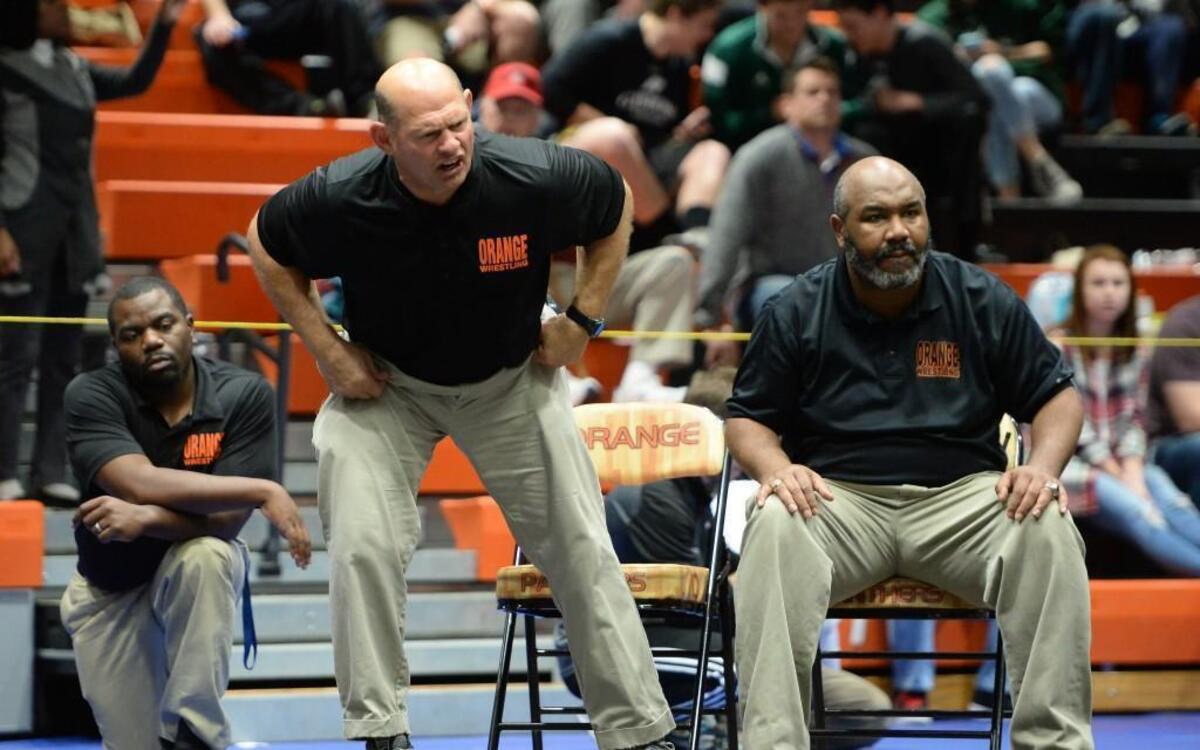 Bobby Shriner, center, head coach of Orange shouts instructions during the 120 lbs final. The Jim King Orange Invitational was hosted by Orange High School in Hillsborough, N.C. on Saturday, December 6, 2014.