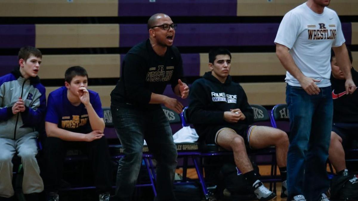 Riverside coach Brandon Palmer calls out to his team in the 4A East semifinal of the NCHSA dual-team tournament at Holl Springs on Tuesday, February 5, 2015.