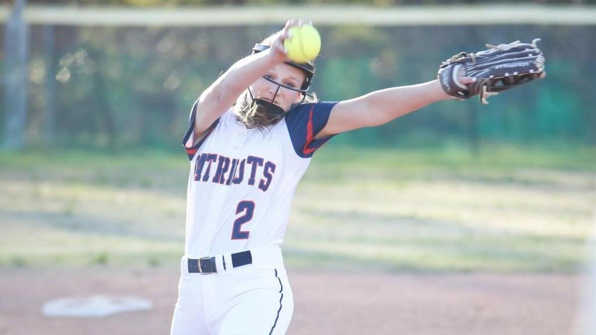 Apex Friendship's Karen Dunterberg (2) pitches during Apex Friendship's softball game at Cary on Tuesday, March 15, 2016. Apex Friendship won the game 12-5.