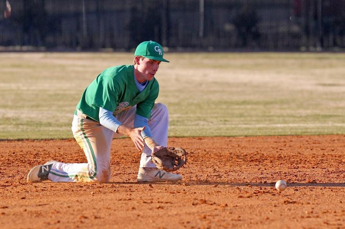 J.H. Rose shortstop Gregory Hardison (8) fields the baseball during the J.H. Rose High School boy's baseball game against D.H. Conley High School in Greenville, N.C. on Thursday, March 16, 2017.