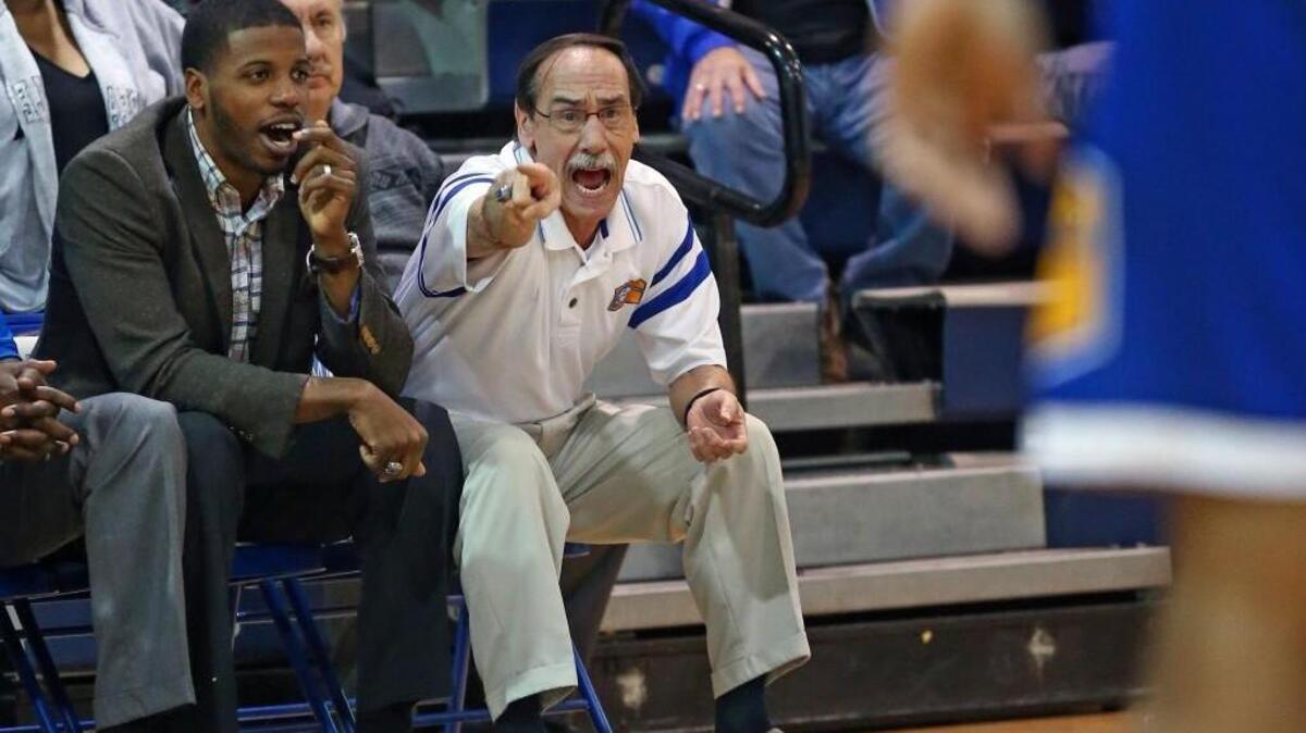 Coach Eddie Gray directs his troops on his way to his 500th career victory. Coverage from the prep basketball game between the Garner High Trojans and the Clayton High Comets played in Clayton, N.C. on Tuesday, January 31, 2017. The Garner boys defeated Clayton 80-59 marking the 500th career victory for Coach Eddie Gray. The Clayton girls defeated Garner 62-44.