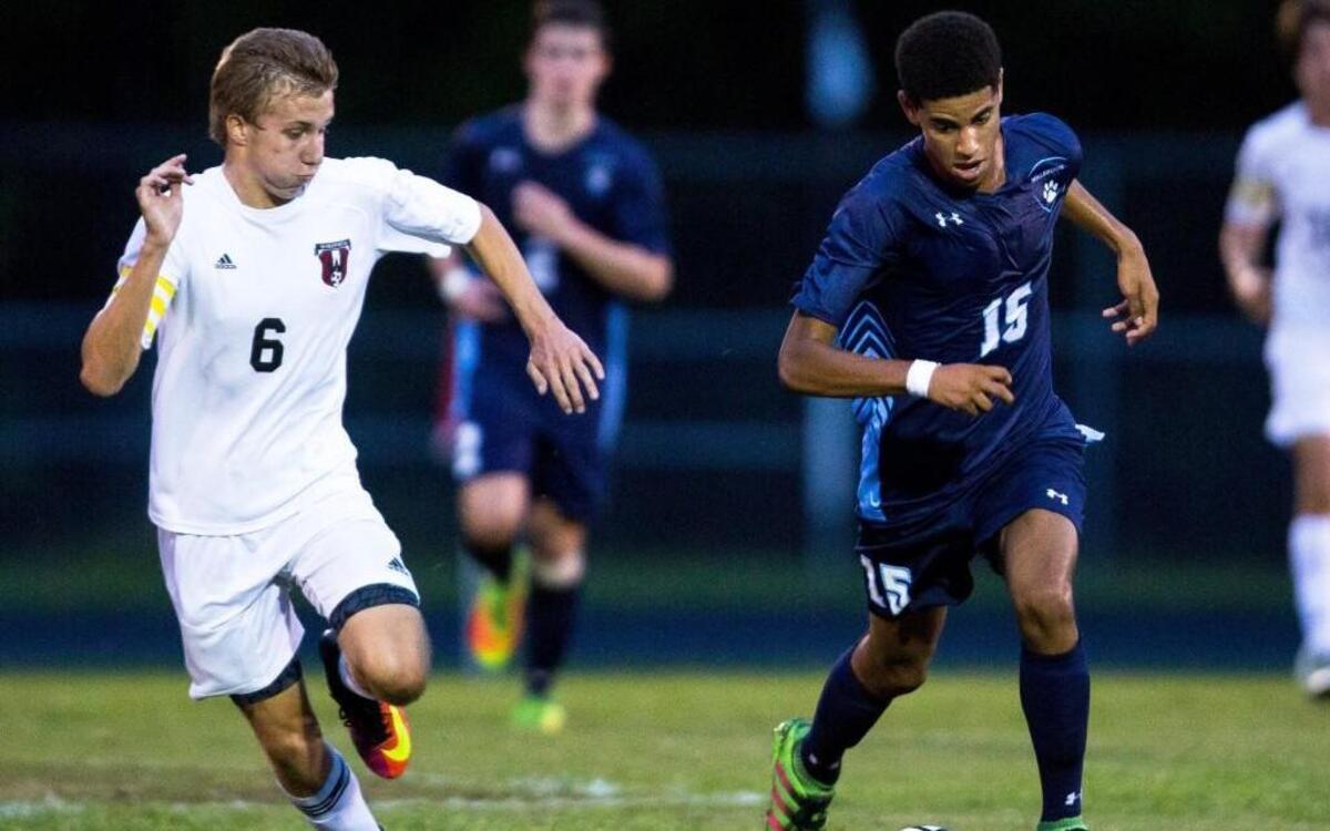 Millbrook's Harrison Clark (15) races Wakefield's Charles Johnson (6) for the ball during a high school soccer game in Raleigh, N.C. on Wednesday, Sept. 21, 2016.