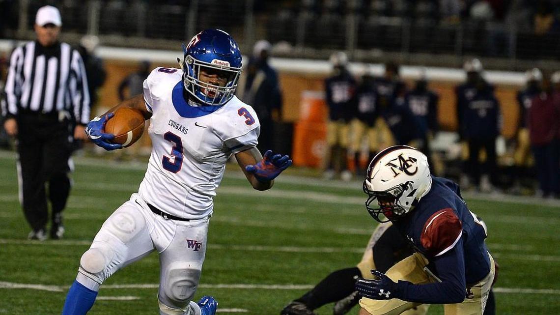 Wake Forest Cougars running back Devon Lawrence, left, breaks to the outside on a run against the Mallard Creek Mavericks during fourth quarter action of the 4AA Football State Championship game at BB&T Field on the campus of Wake Forest University in Winston-Salem, NC on Saturday, December 9, 2017. Wake Forest defeated Mallard Creek 21-0.