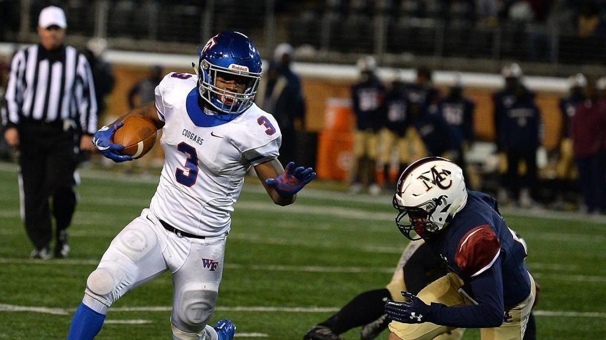 Wake Forest Cougars running back Devon Lawrence, left, breaks to the outside on a run against the Mallard Creek Mavericks during fourth quarter action of the 4AA Football State Championship game at BB&T Field on the campus of Wake Forest University in Winston-Salem, NC on Saturday, December 9, 2017. Wake Forest defeated Mallard Creek 21-0.