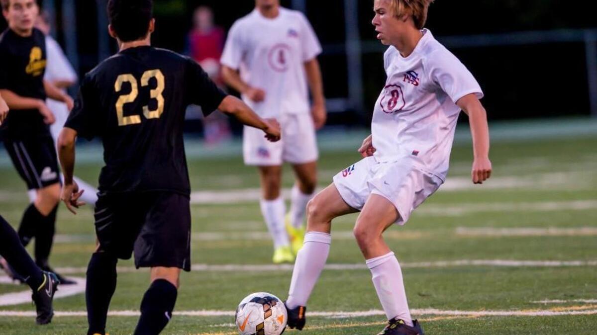 
Sanderson’s Matthew Prakke (8) attempts to get past Cardinal Gibbons defender Cesar Palacios (23) on Friday, September 19, 2014 in the Wake County Cup boys soccer championship. Cardinal Gibbons won 5-0.
