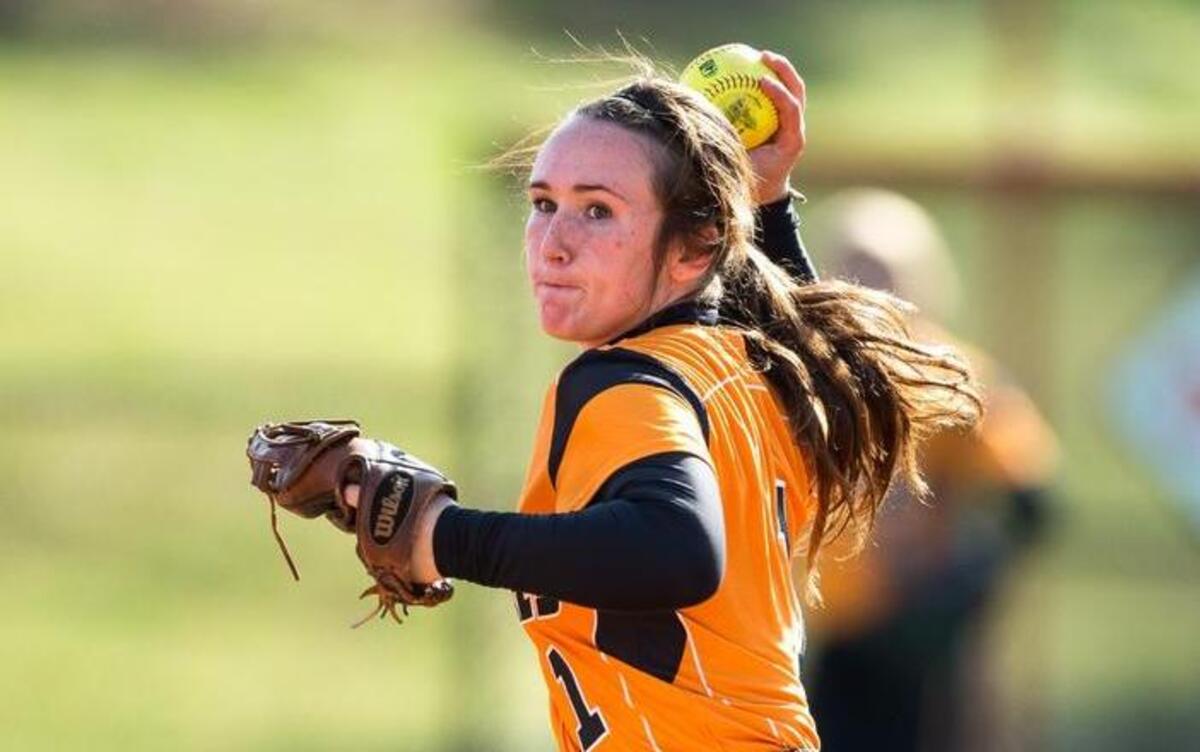 Fuquay-Varina's Ashlyn Long throws to first base during a high school softball game against Panther Creek in Fuquay-Varina, N.C. on Wednesday, May 4, 2016.