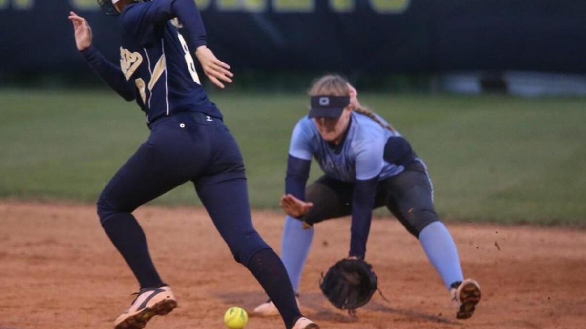 Lee County’s Savannah Patterson (8) dogdes the ball as Cleveland’s Rebecca Straka (8) fields the ball.