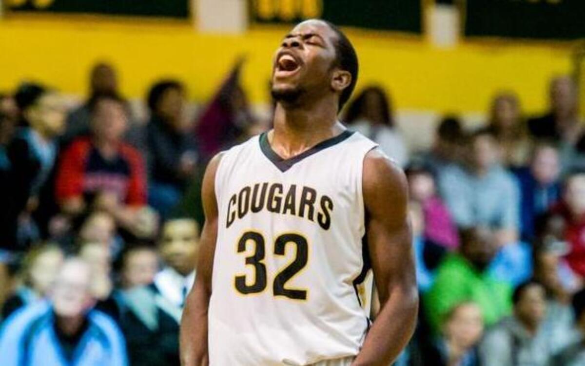 Apex’s Ian Boyd (32) reacts with a yell after a nice play by a teammate against Panther Creek during the boys basketball game on January 9, 2015 in Apex, N.C.