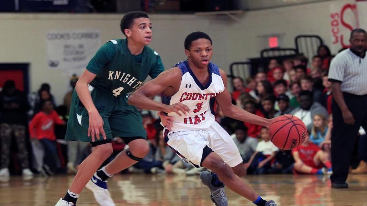 Wayne Country Day School's Jimmie Sanders dribbles past Greenfield's Dji Bailey during the Greenfield at Wayne Country Day basketball game on January 20, 2017.