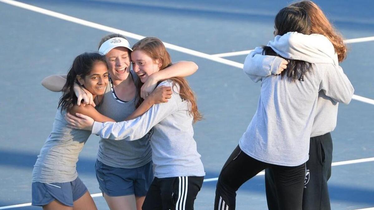 Raleigh Charter celebrates the win at the end of the women dual team tennis games between the Raleigh Charter Phoenix and the Mount Airy Granite Bears that took place at the Burlington Tennis Center in Burlington, N.C. on Saturday, November 12, 2016.