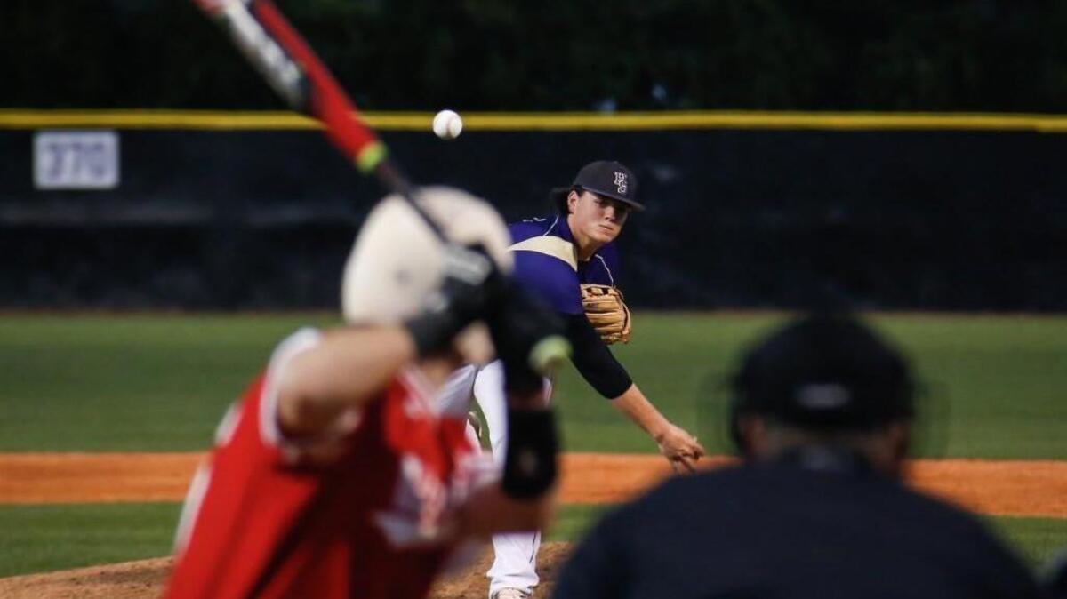 Holly Springs’ Jake Isbell pitches to Middle Creek's John D'ercole (26) during Middle Creek's baseball game at Holly Springs on Tuesday, March 15, 2016. Holly Springs won the game 7-0 on the strength of Isbell's one-hit performance.