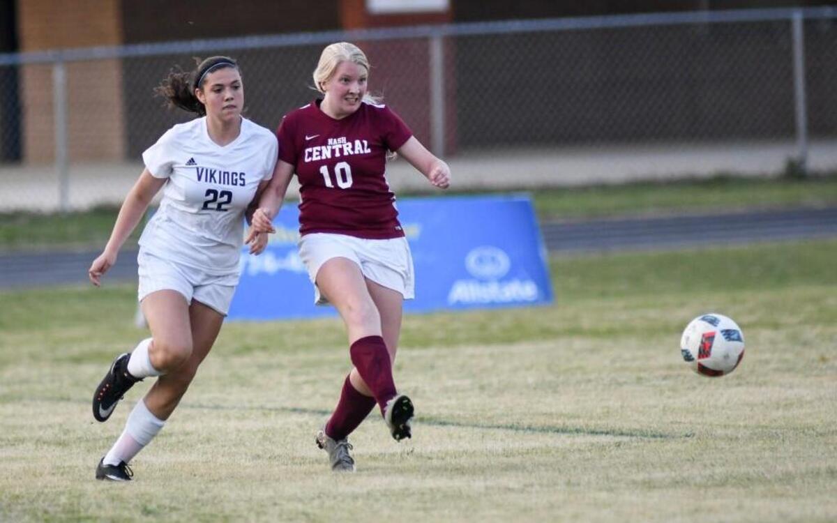 Nash Central's Lauren Keel (10) kicks ball away from Union Pines' Alysha Leitshuh (22) during the Nash Central High School girl's soccer game against Union Pines High School in Sanford, N.C. on Wednesday, May 10, 2017. Nash Central won 2-1.