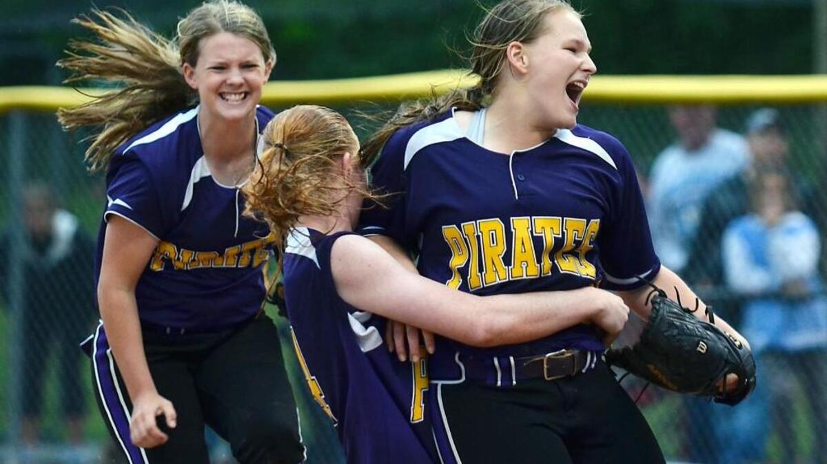 Corinth Holders pitcher Shanan Hester (right) is rushed by teammates Ashlyn Biethman and Hailey Allen after throwing the final pitch in a win over Northwood in the third round of the N.C. High School Athletic Association 3A softball playoffs in Pittsboro, N.C. Friday, May 20, 2016. Corinth Holders won 10-8.