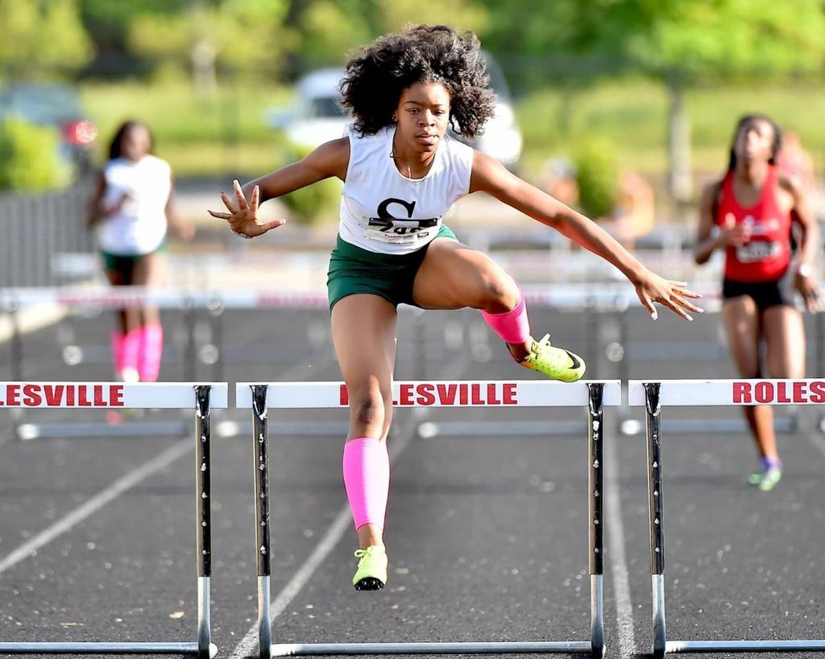 Southeast Raleigh's Sierra Fletcher clears the last hurdle to win the Girls 300m hurdles. The Greater Neuse River Conference held its Outdoor Track & Field Championships at Rolesville High School in Rolesville, N.C. on April 26, 2017.