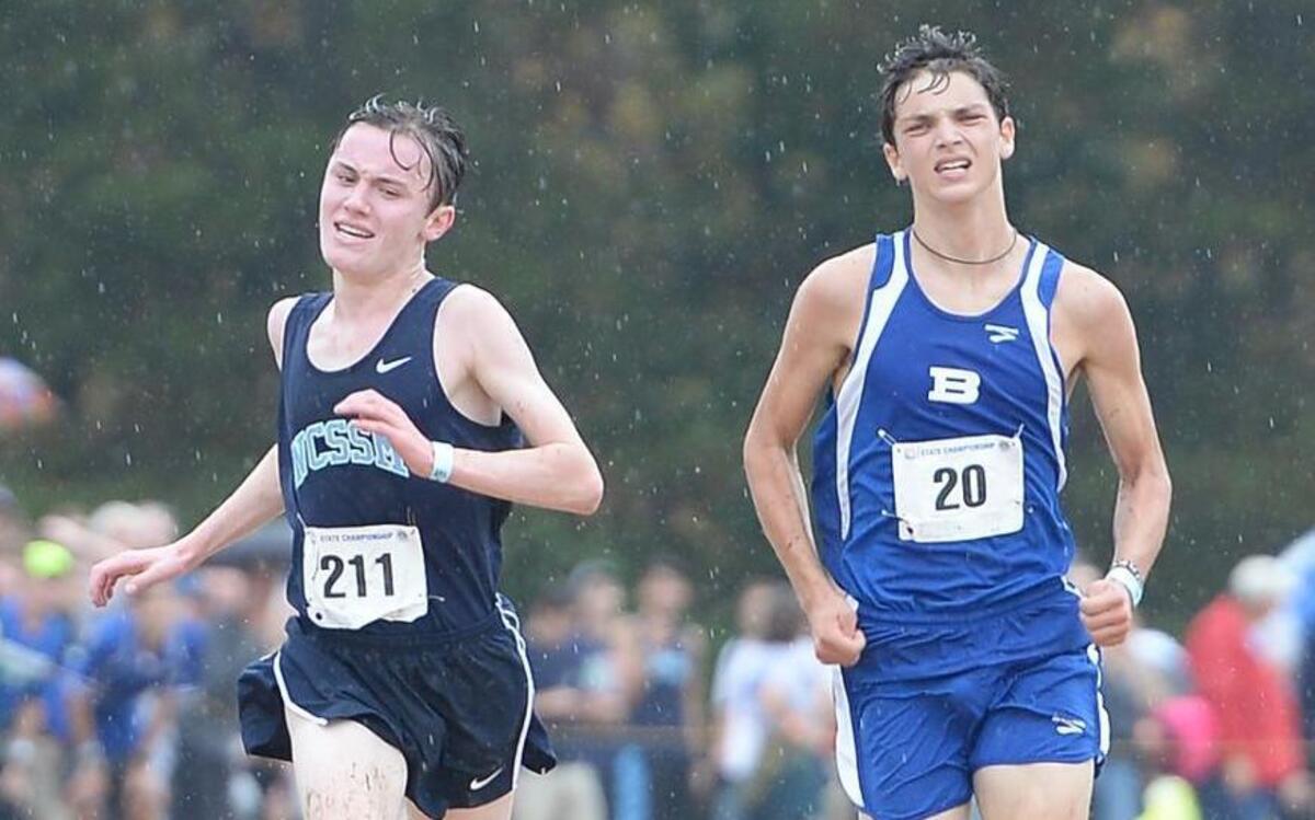 Frank Kenny, left, of NC School of Science and Math beats Noah Graham, right, of Brevard to the finish line during the 2A NCHSAA Cross Country Championships that took place at the Ivey M. Redmon Sports Complex in Kernersville, N.C. on Saturday, November 7, 2015.