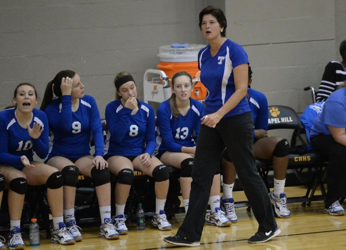 Wendy Gaines, center, head coach of Triton instructs her players from the sideline. The Chapel Hill Tigers played the Triton Hawks in a volleyball game that took place in Chapel Hill, N.C. on Thursday, November 3, 2016. Chapel Hill won 3-0.
