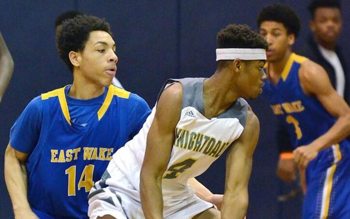 Knightdale’s Carnell Watkins (4) looks for an opening in the East Wake defense while defended by the Warriors’ Jalen Vick (14) during their game at Knightdale High School in Knightdale, N.C. Friday, Jan. 15, 2016.