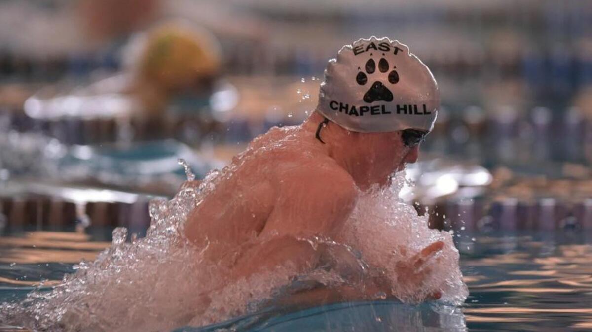 East Chapel Hill sophomore Connor Sept swims the boys 100 yard breaststroke event during the PAC-6 Conference Swimming Championship at the Triangle Aquatic Center in Cary, NC on Thursday, January 28.