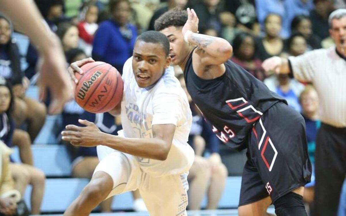 South Granville's Taariq Branch (11) drives hard to the hoop during the Franklinton high school basketball game at South Granville high school on February 10, 2017, in Creedmoor , N.C . South Granville won the game 58-57.