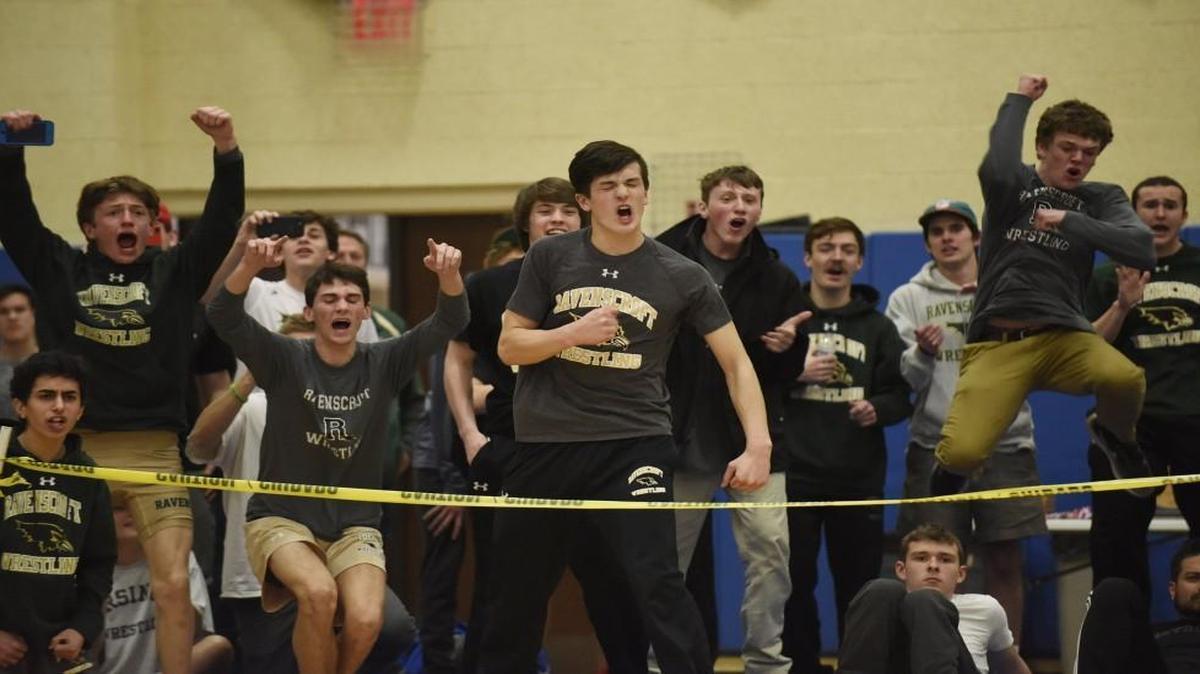 Ravenscroft wrestlers cheer on their teammate during the NCISAA State Wrestling Tournament in Cary, N.C. on Saturday, February 18, 2017.