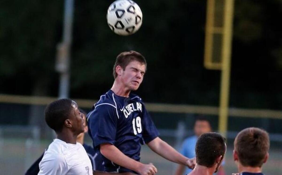 
Cleveland defender Dylan Bradford (19) goes high to win a header in a 2013 match.
