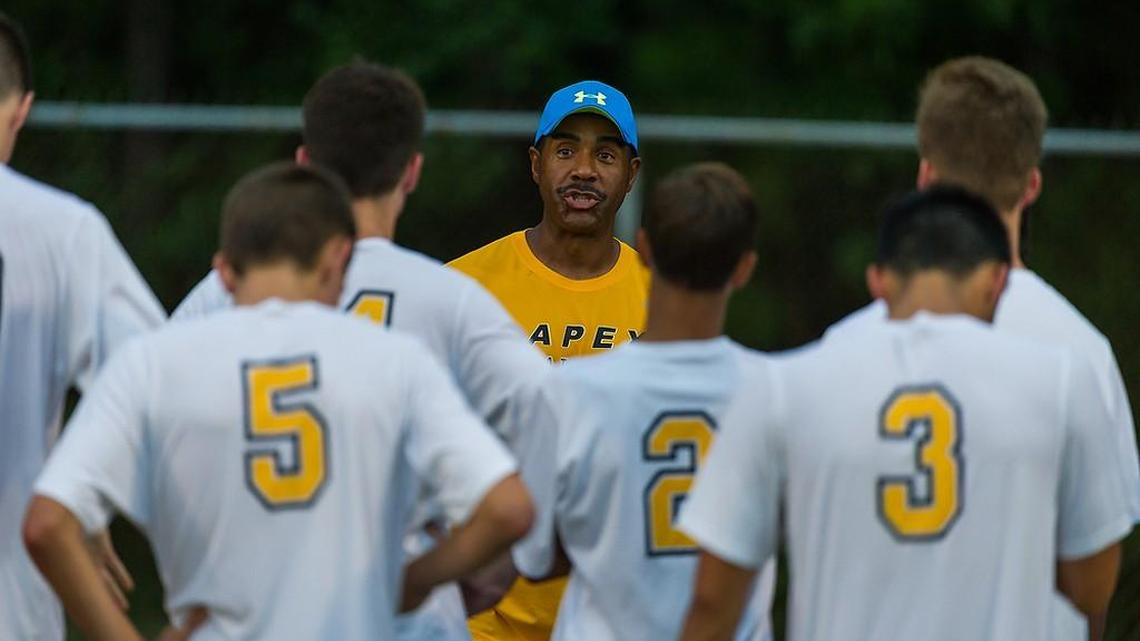 Apex head coach Kevin Todd talks to his team at half time of the Apex Cougars defeat the Cary High Imps 6-1 at Cougar Stadium at Apex High School in Apex, NC on Wednesday, September 2, 2015.