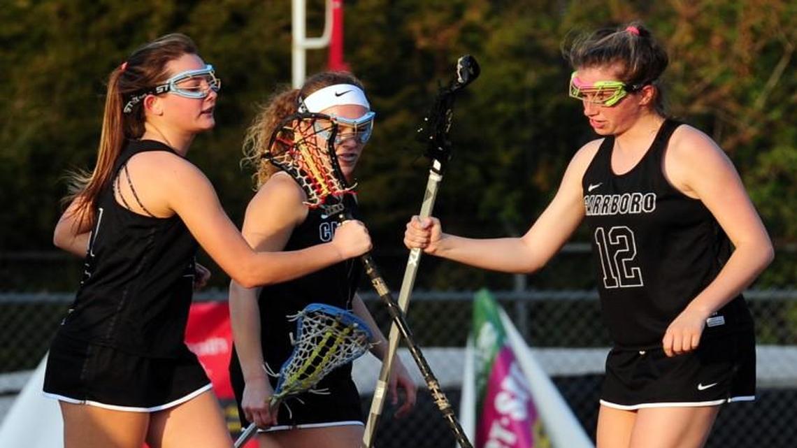 Father-daughter combo enjoying the ride with Carrboro girls lacrosse