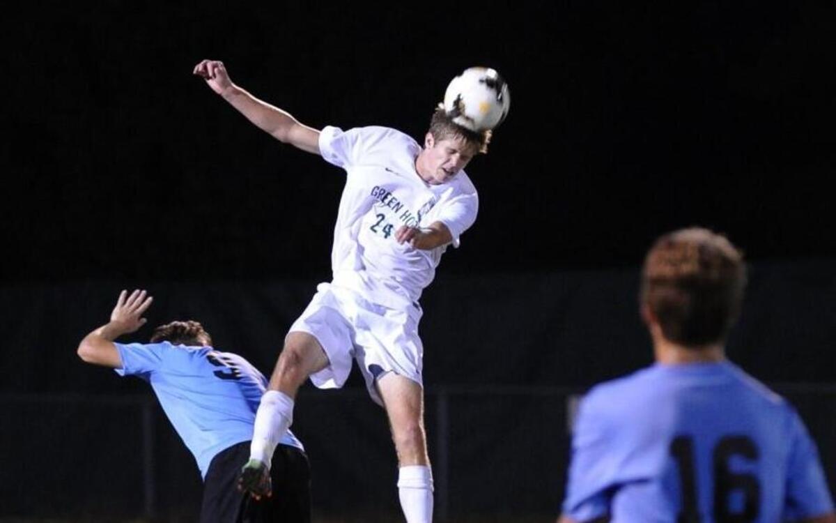 Green Hope's Zach Curtis heads the ball during the soccer game against Panther Creek, which was played in Cary on Wednesday, October 12, 2016. Green Hope won 4-0.