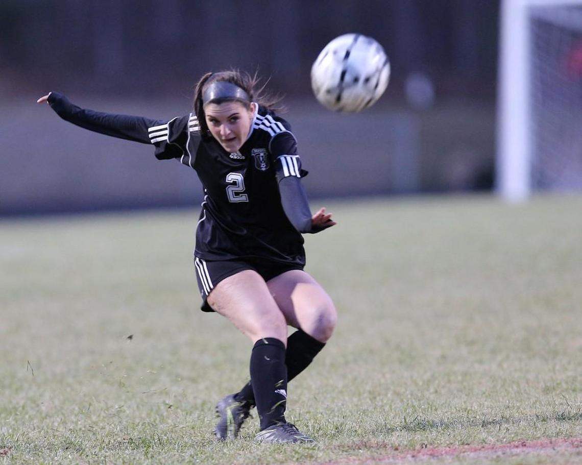 Wakefield's Kaitlyn Bouck (2) kicks the ball goalward during the Sanderson Spartan high school soccer game with the Wakefield Wolverines high school , March 16, 2017, in Raleigh , N.C.
