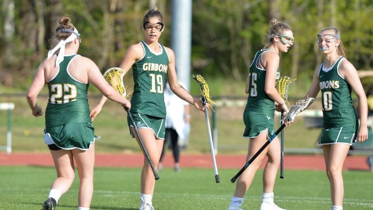 Cardinal Gibbons enters the postseason ranked No. 1 in the N&O area and the state. Erica Skowron (19) of Cardinal Gibbons celebrates a goal along her teammates Morgan Winstead (22), Cassie New (15) and Elizabeth Wilson, right. The Durham Academy Cavaliers played the Cardinal Gibbons Crusaders in a girls lacrosse game that took place in Durham, N.C. on Monday, April 11, 2016. Cardinal Gibbons won 18-8.