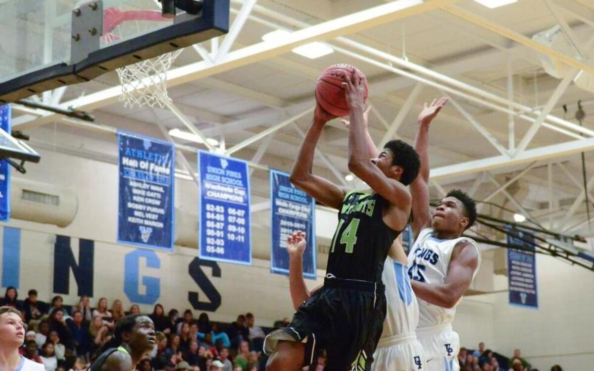 Pinecrest’s Phillip Russell (14) drives in for bucket during matchup between Pinecrest and Union Pines that took place at Union Pines High School on December 16, 2016 in Cameron, North Carolina. Union Pines girls defeated Pinecrest 41-30. Pinecrest boys defeated Union Pines 71-35.