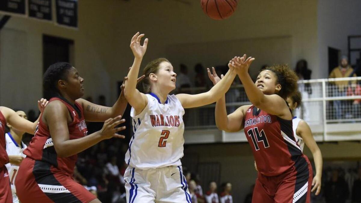 Louisburg's Taylor Ferguson (2) Franklinton's Bria Gaither (40) and Amber Rushing (14) go after a loose ball in Louisburg, N.C. on Friday, December 9, 2016. Franklinton won 28-21.