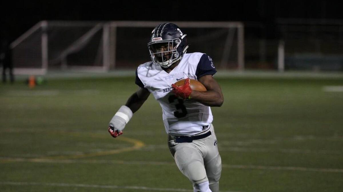 Heritage's Ricky Person Jr. (3) runs to open field.The Cardinal Gibbons Crusaders football team has a home 2nd round playoff game vs. Heritage Huskies on Friday, November 17, 2017. Raleigh ,N.C.