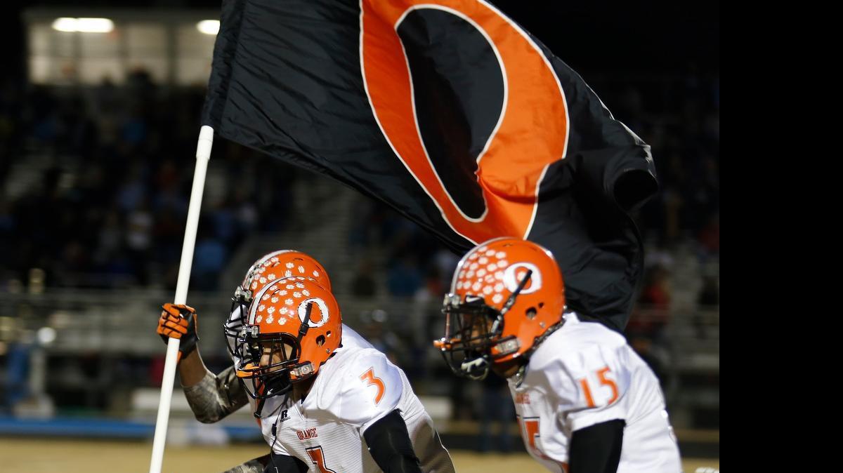 
Orange takes the field before a playoff game at Cleveland on Nov. 22, 2013. Orange won 59-50.
