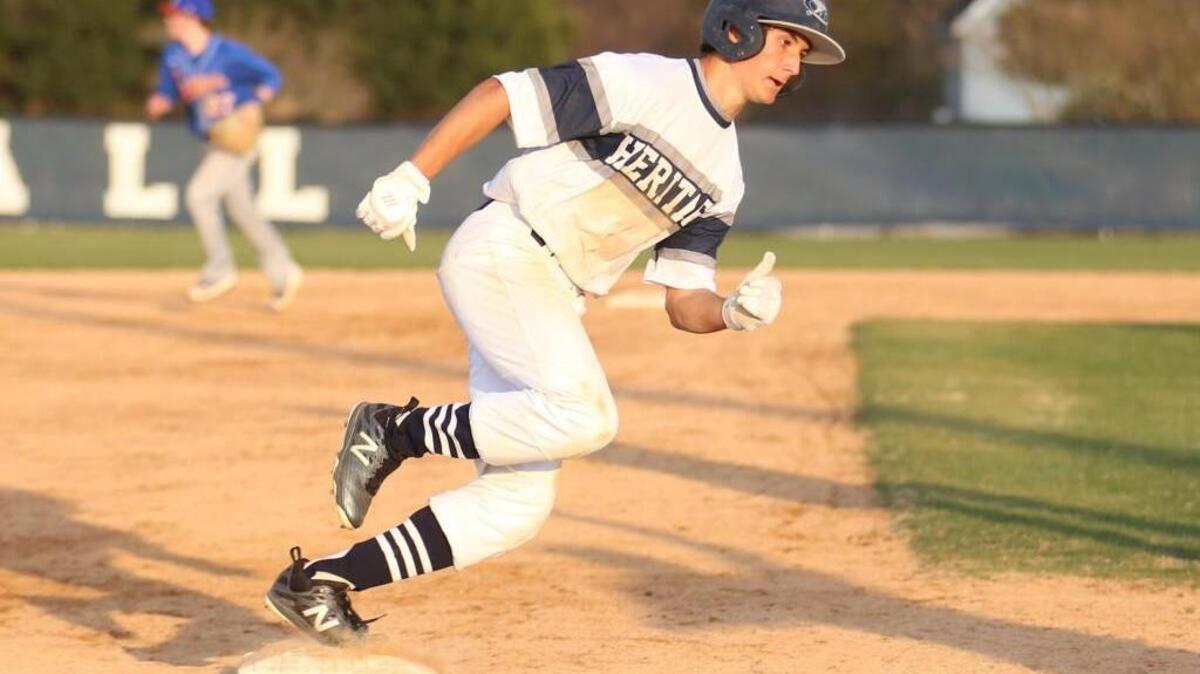 Heritage's Christian Staresina (7) runs across third base on his way home during Wake Forest's baseball game at Heritage on Tuesday, March 21, 2017. Heritage won the game 9-4.