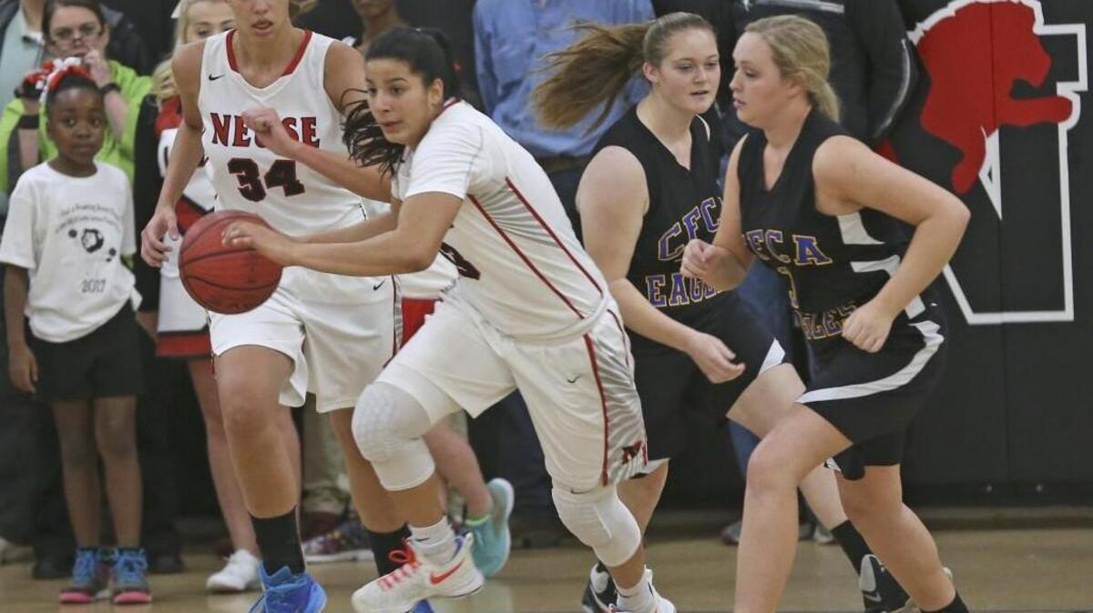 Neuse Christian's Izabela Leite (33) and Izabel DeAngelo (34) starts fast break on Cape Fear's Kris Anna McLamb's (3). Coverage from the prep basketball games between the Neuse Christian Academy Lions and the Cape Fear Christian Academy Eagles played in Raleigh, N.C. on Friday, January 27, 2017. The Neuse Christian Academy Girls defeated Cape Fear Christian Academy 51-27 and the Cape Fear Boys defeated Neuse Christian 102-94.