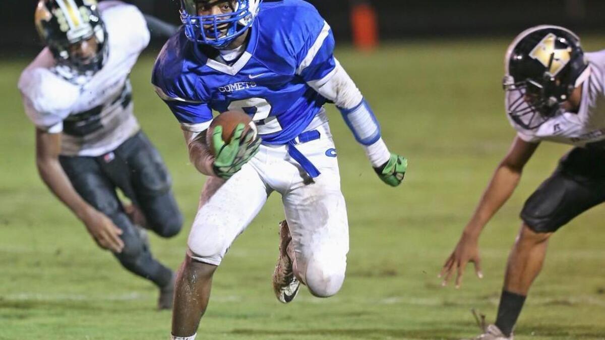 Clayton's Macaleb Robertson (2) takes this Austin Cagle pass down the sideline for a 44 yard touchdown run that put the Comets up 14-7 late in the second quarter on Friday. Clayton defeated Knightdale 36-7.