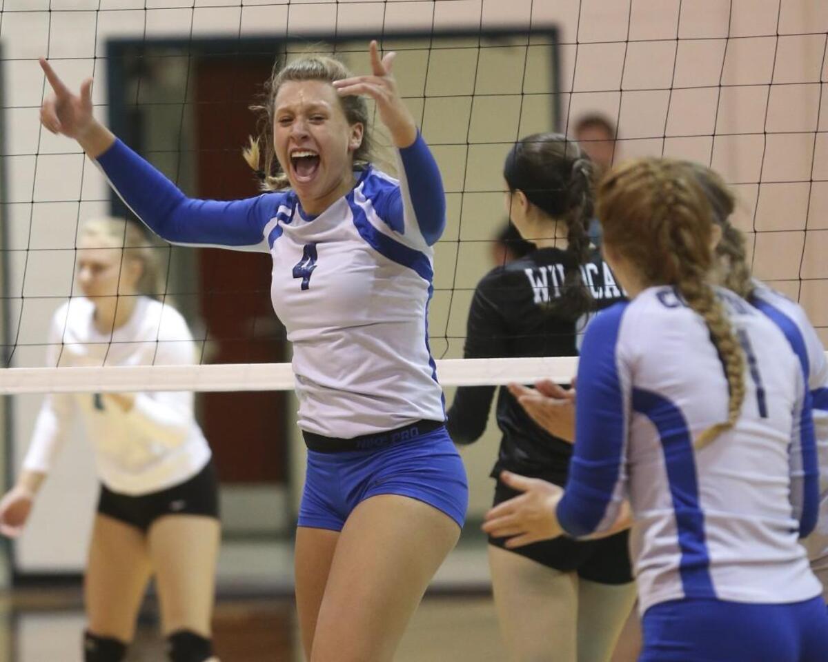 Clayton’s Maya Gray (4) reacts to the game point as the Comets seal the victory. The five-set win over West Johnston extended the Comets’ win streak to 13 matches to start the season.